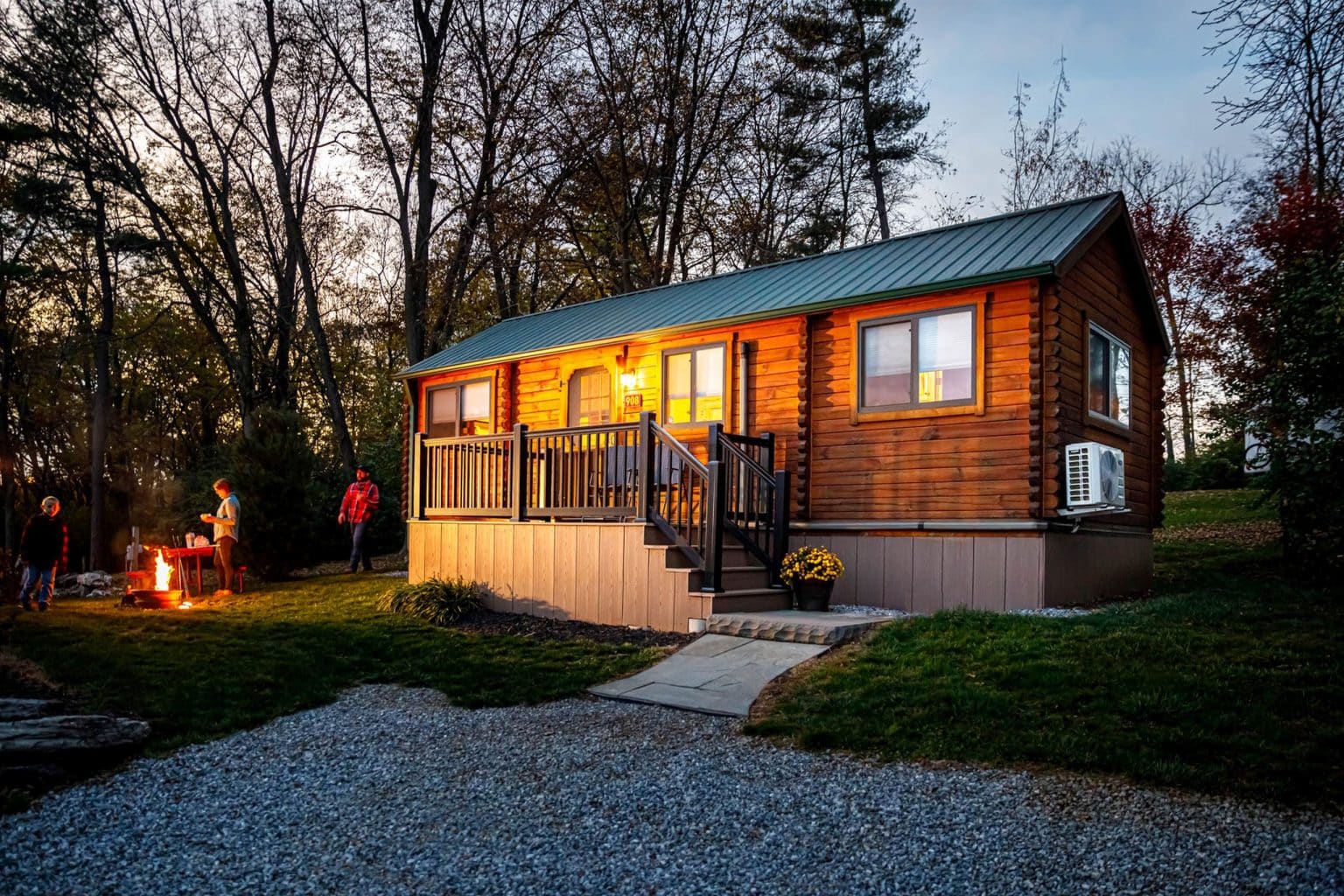 Country Acres cabin exterior with campfire at night